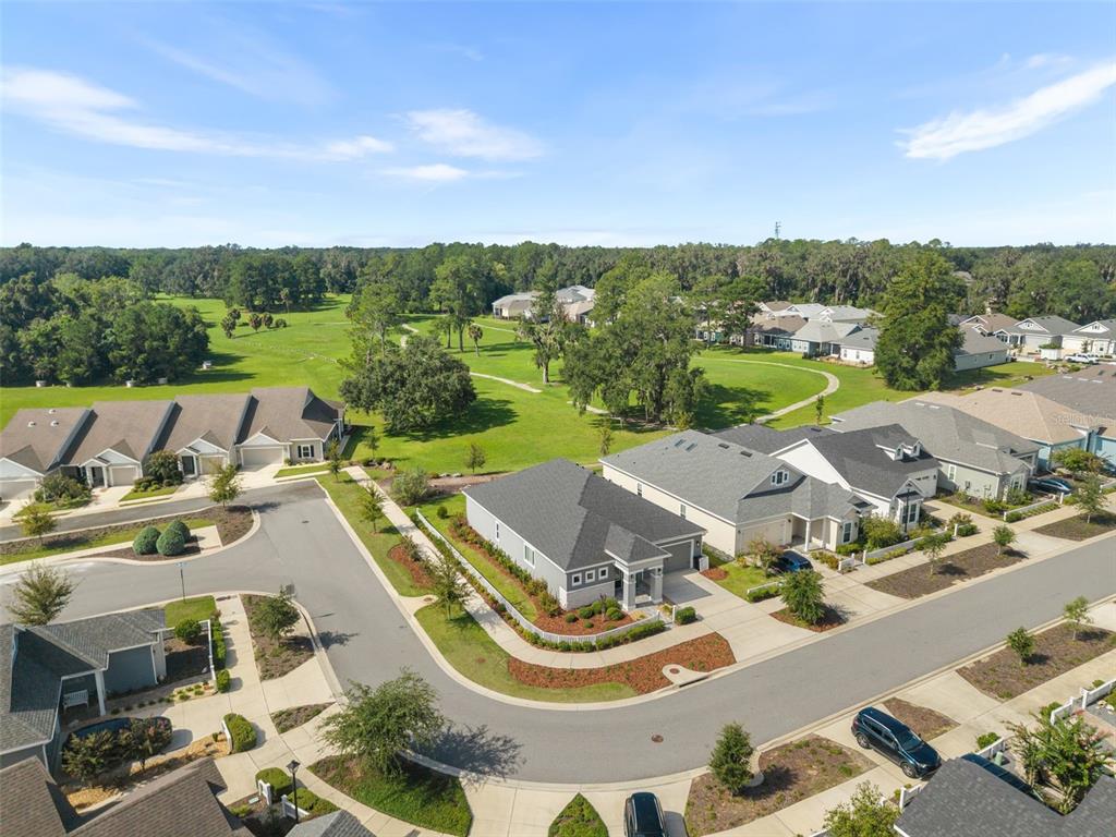 An aerial view shows a residential neighborhood with a red pin marking a specific house — 1429 NW 132ND BOULEVARD, NEWBERRY, FL