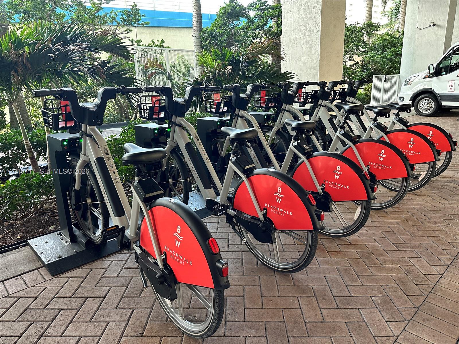 A row of Beachwalk Resort rental bicycles is parked in a paved outdoor area — 2602 E Hallandale Beach Blvd # R703, Hallandale Beach FL 33009, HALLANDALE BEACH, FL