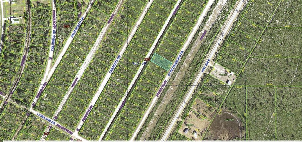 This is an aerial map showing a highlighted parcel of land surrounded by dirt roads — ST PETERSBURG DRIVE, INDIAN LAKE ESTATES, FL