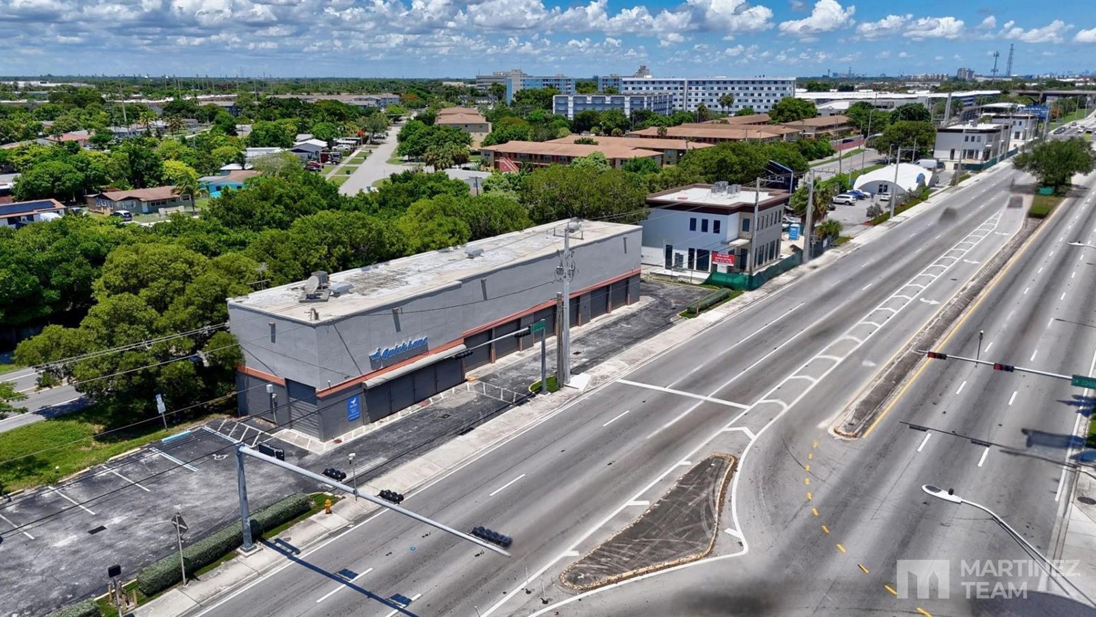 An aerial view shows a commercial building with a parking lot next to a highway — 20390 S Dixie Highway, Cutler Bay FL 33189, CUTLER BAY, FL