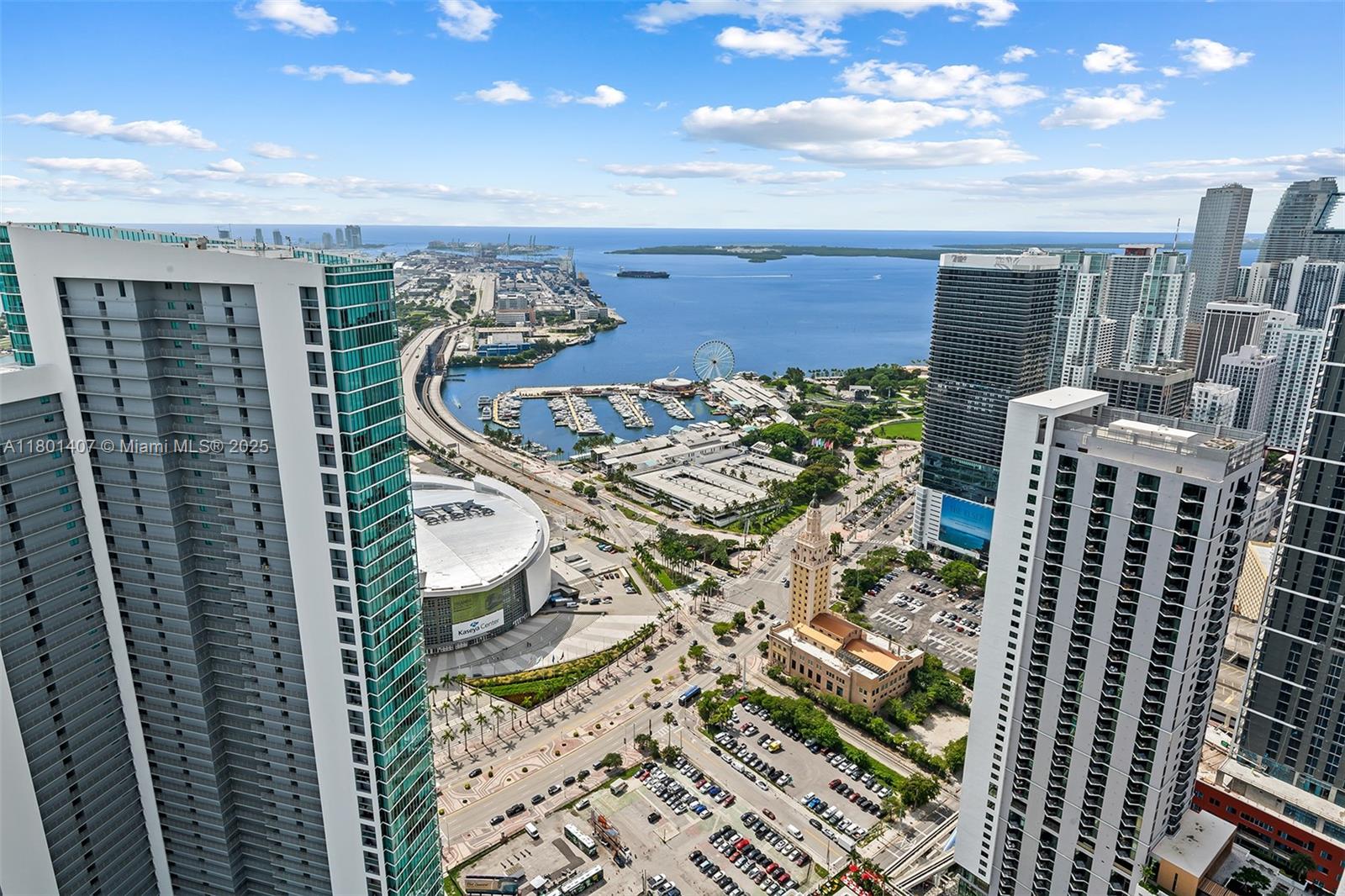 An aerial view shows a Miami cityscape with high-rise buildings, the Kaseya Center, and a harbor — 851 NE 1st Ave # 5401, Miami FL 33132, MIAMI, FL