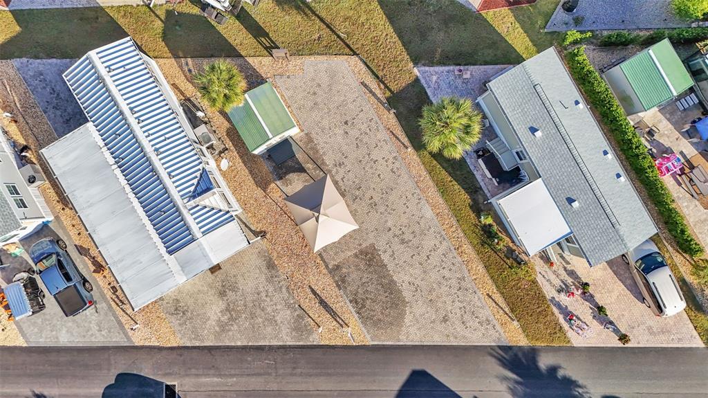 An aerial view shows two mobile homes with paved driveways, a gazebo, and parked vehicles — 2436 CITRUS TREE ROAD, CLERMONT, FL
