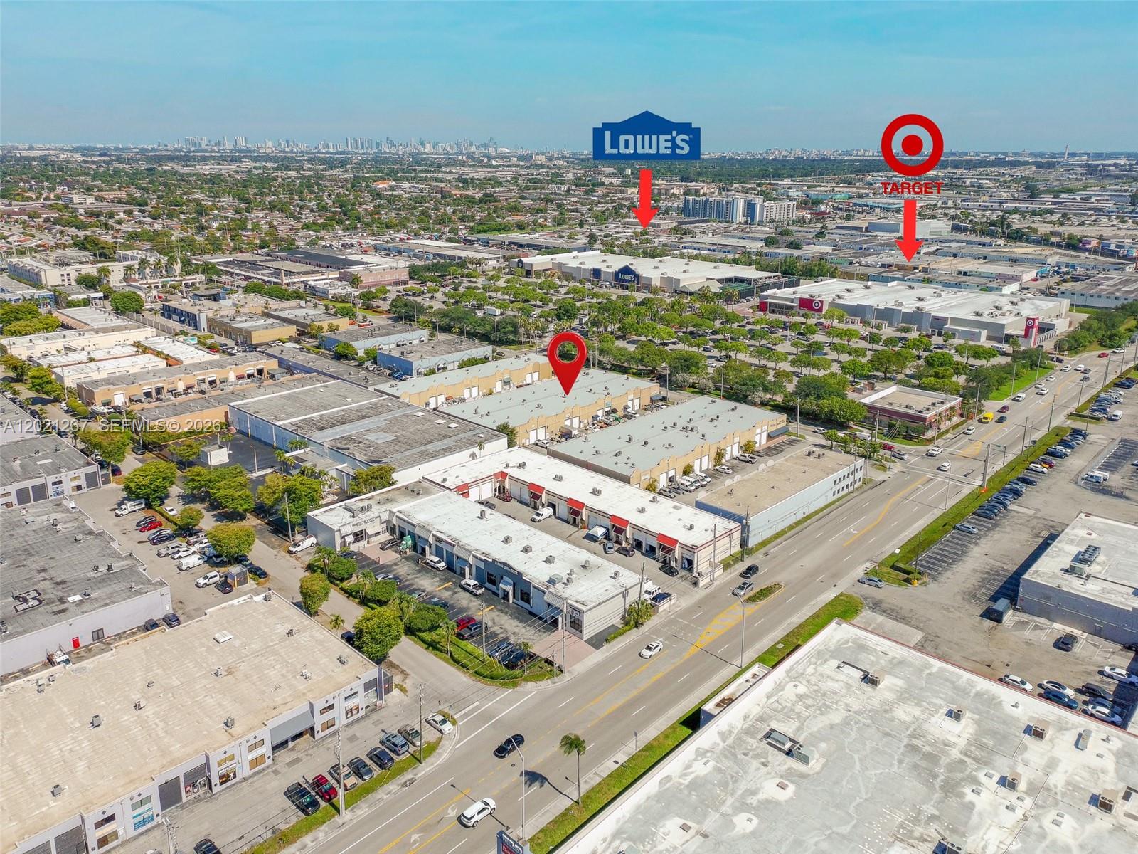 An aerial view shows a commercial warehouse complex with nearby retail stores and parking lots — 1745 W 37th St # 5, Hialeah FL 33012, HIALEAH, FL