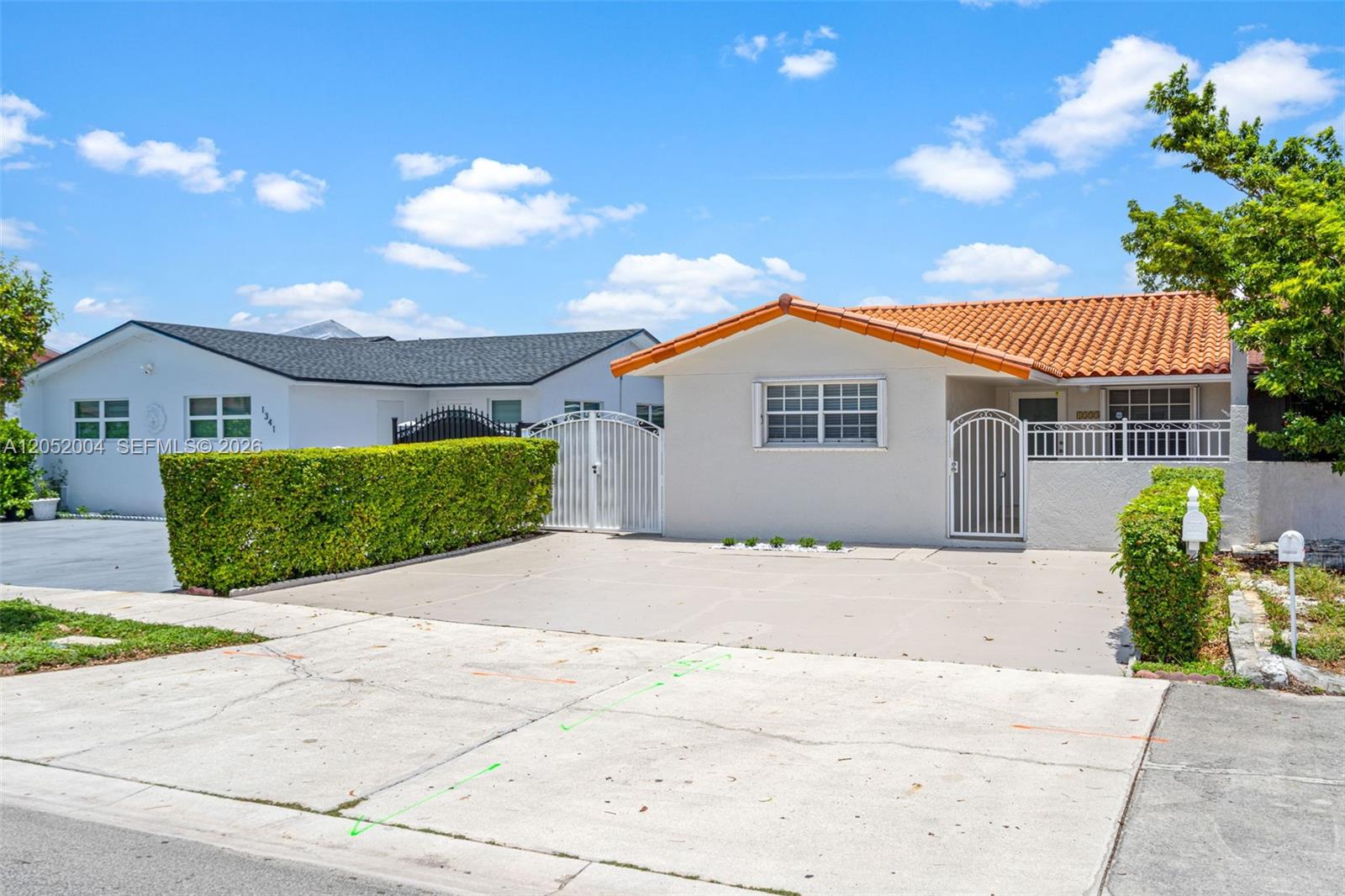 A single-story house with a terracotta tile roof and a concrete driveway — 1333 W 37th St, Hialeah FL 33012, HIALEAH, FL