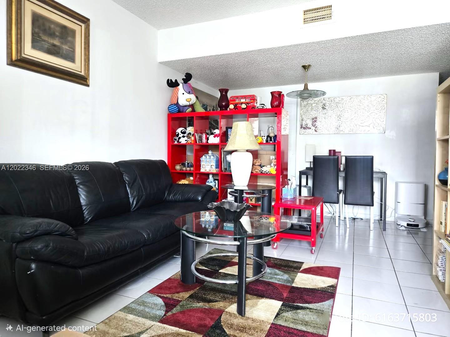 A small kitchen features white cabinets, white countertops, a stainless steel sink, and a refrigerator — 900 SW 104th Ct # 108, Miami FL 33174, MIAMI, FL