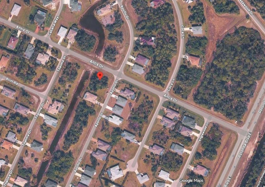 This is a satellite map view of a residential neighborhood with houses and streets — 155 APOLLO DRIVE, ROTONDA WEST, FL