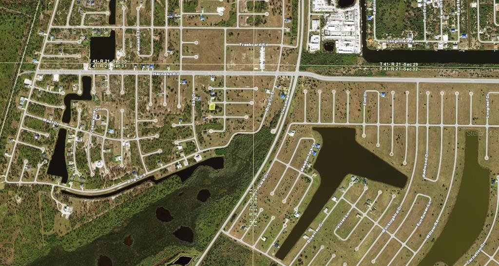 This is an aerial map showing residential streets, undeveloped lots, and waterways — 5 HULL COURT, PLACIDA, FL