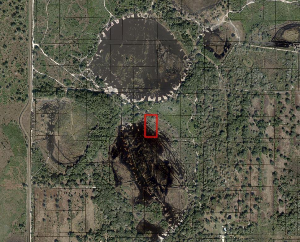 This is an aerial map view showing a rectangular property boundary outlined in red — 0 NW 298th Street, Okeechobee FL 34972, OKEECHOBEE, FL