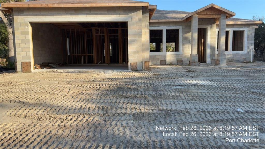 A single-story house under construction with concrete block walls and an open garage — 17364 COX AVENUE, PORT CHARLOTTE, FL