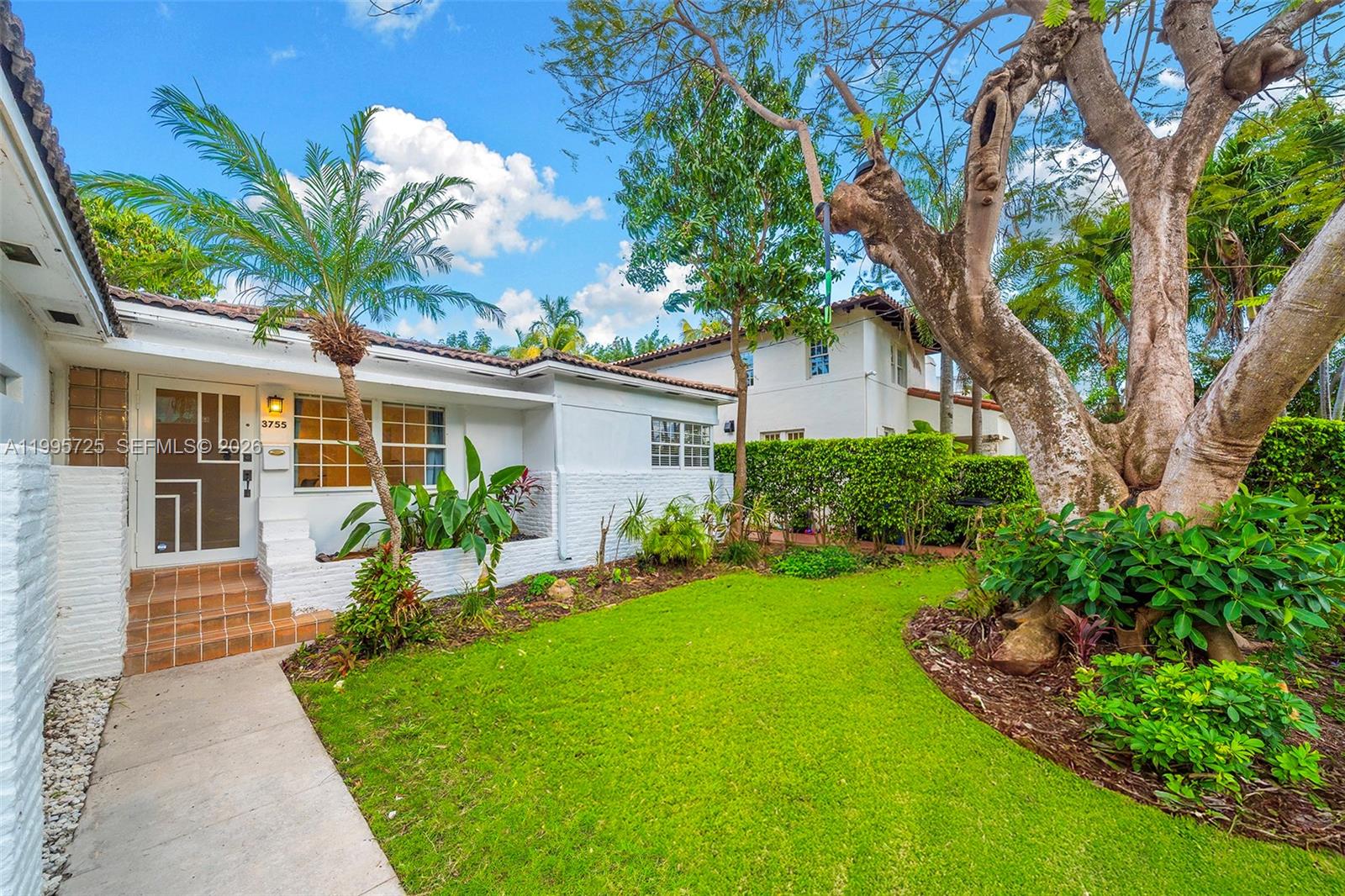A white house with a palm tree, a large tree, and a green lawn — 3755 Royal Palm Ave, Miami Beach FL 33140, MIAMI BEACH, FL