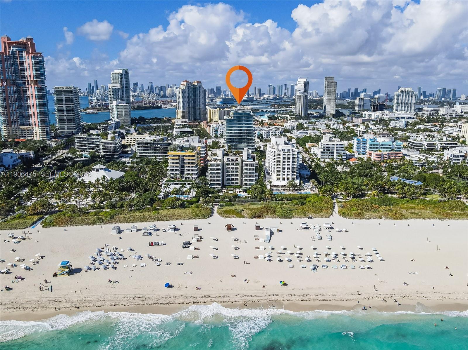 An aerial view shows a beach in the foreground and high-rise buildings in Miami — 120 Ocean Dr # 700, Miami Beach FL 33139, MIAMI BEACH, FL