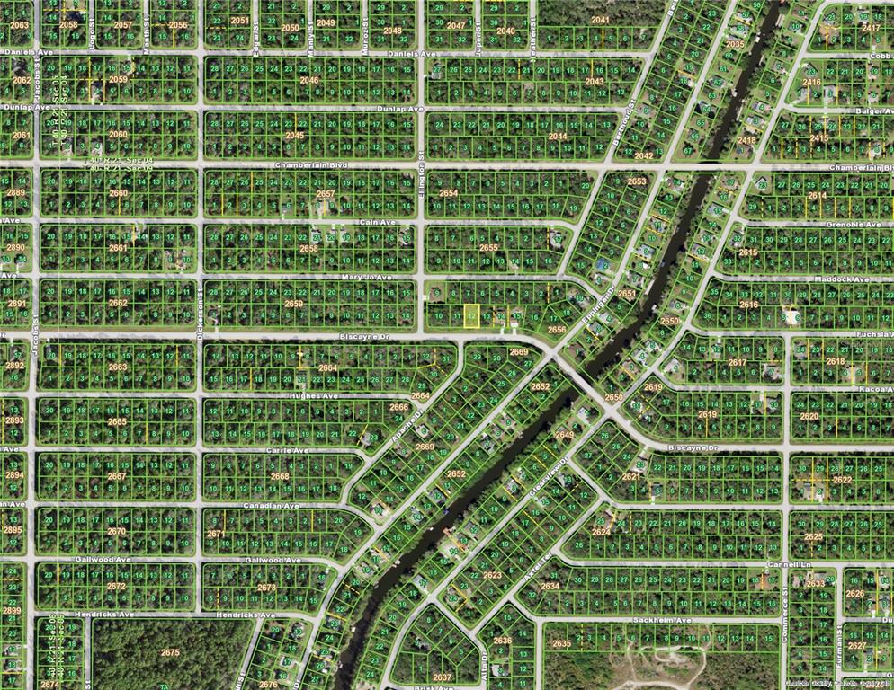 This is a satellite map view of a residential neighborhood with gridded streets and lots — 1044 BISCAYNE DRIVE, PORT CHARLOTTE, FL
