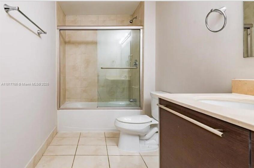 A bathroom features a tiled shower-tub combination, a white toilet, and a dark wood vanity — 1900 N Bayshore Dr # 3909, Miami FL 33132, MIAMI, FL