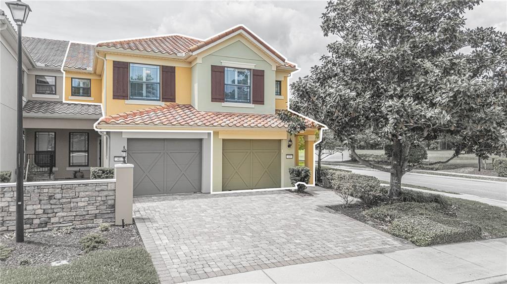 A two-story townhouse with a two-car garage and a paved driveway — 43 FAWN GULLY LANE UNIT F, PONTE VEDRA, FL