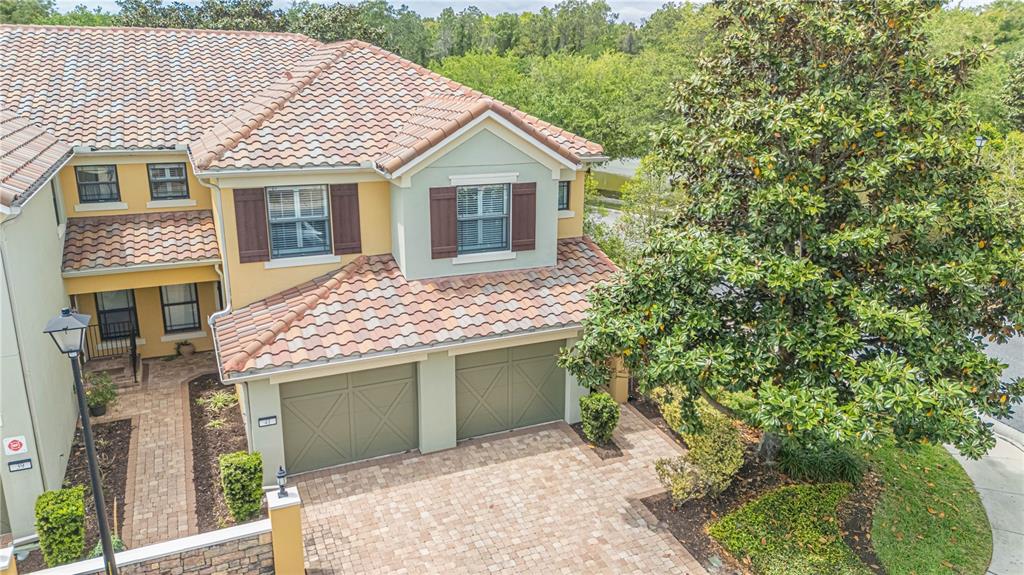 An elevated view of a two-story house with a tiled roof and a two-car garage — 43 FAWN GULLY LANE UNIT F, PONTE VEDRA, FL