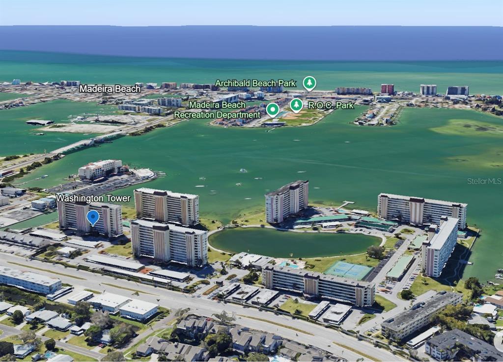 This is an aerial map view of a coastal residential area with high-rise buildings — 4550 COVE CIRCLE UNIT 1205, ST PETERSBURG, FL