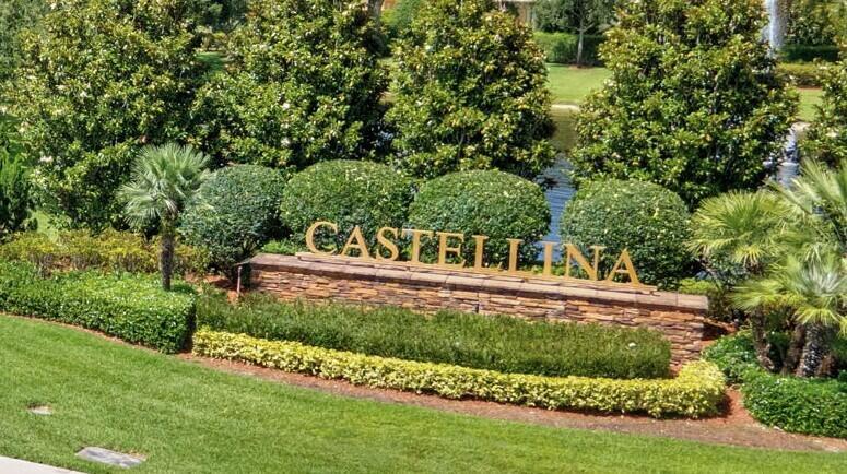 A stone sign displaying the name Castellina sits in a landscaped garden with palm trees — 4023 Siena Circle, Wellington FL 33414, WELLINGTON, FL