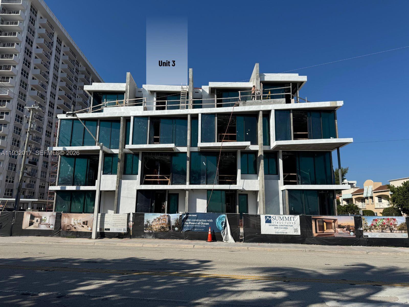 A multi-story residential building under construction with glass windows and concrete balconies — 493 N Ocean Blvd # 3, Pompano Beach FL 33062, POMPANO BEACH, FL
