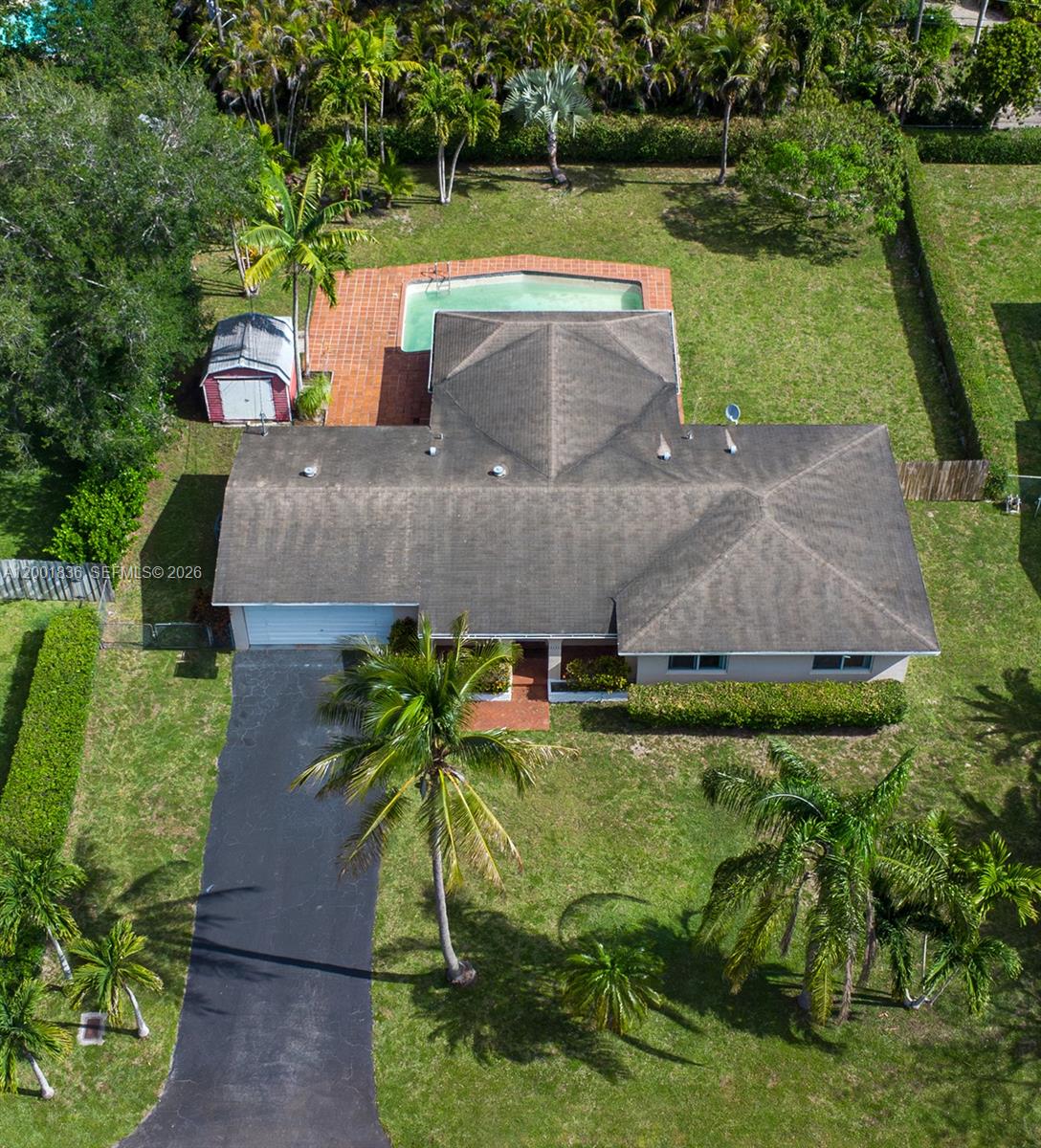 An aerial view shows a single-story house with a pool, shed, and driveway — 8355 SW 131st St, Pinecrest FL 33156, PINECREST, FL