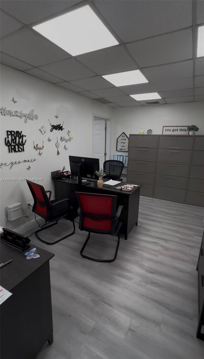 A small office features a desk, two red chairs, and grey filing cabinets — 175 Fontainebleau Blvd, Miami FL 33172, MIAMI, FL