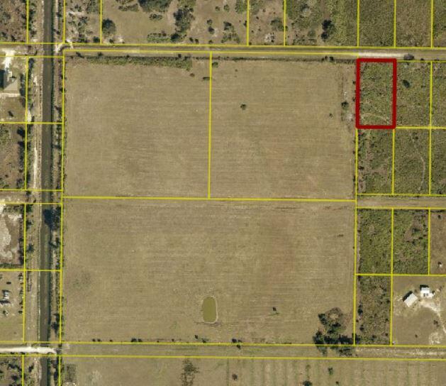 This aerial map shows a rectangular plot of land highlighted in red among other parcels — 18188 NW 268th Street, Okeechobee FL 34972, OKEECHOBEE, FL