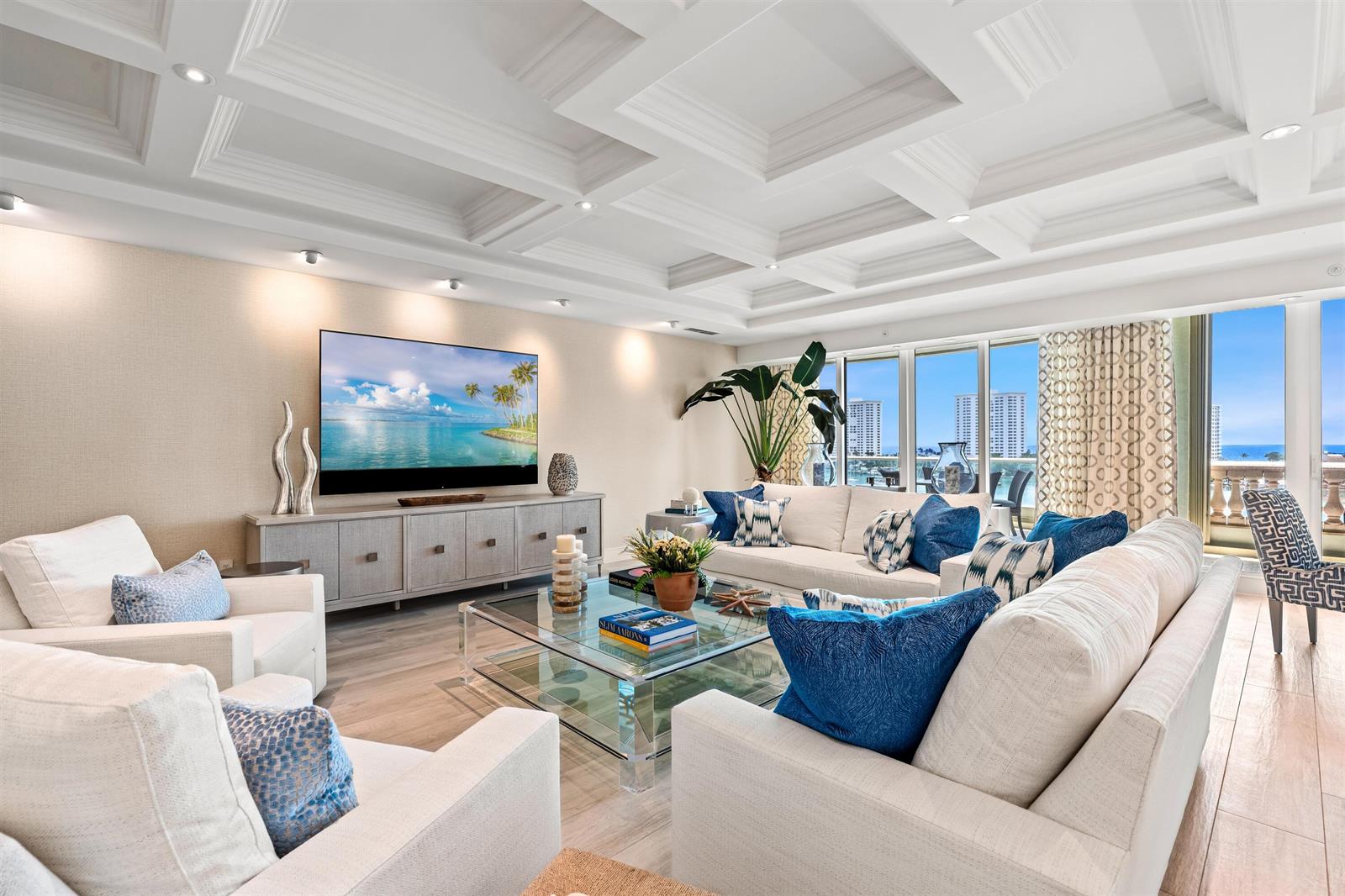 A bright living room features a coffered ceiling, a large television, and floor-to-ceiling windows — 500 SE 5th Avenue # s, Boca Raton FL 33432, BOCA RATON, FL