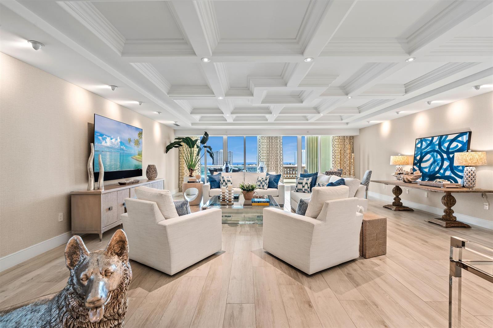 A bright living room features a coffered ceiling, light wood floors, and a balcony view — 500 SE 5th Avenue # s, Boca Raton FL 33432, BOCA RATON, FL