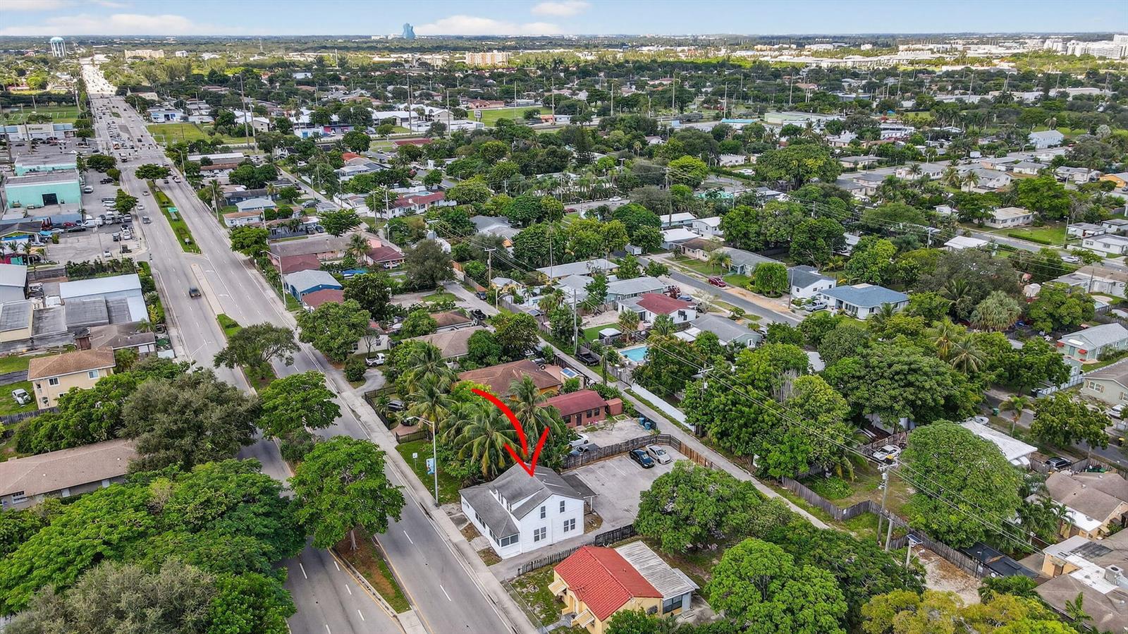 An aerial view shows a white two-story house with a red-roofed building nearby — 220 SW 16th Street, Dania Beach FL 33004, DANIA BEACH, FL