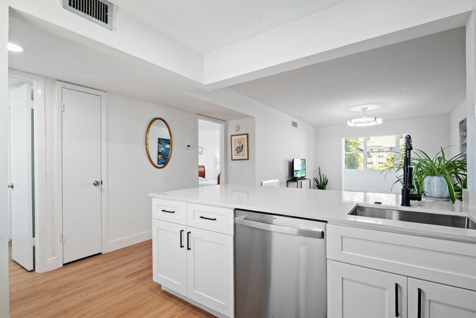 A bathroom features a white vanity, a rectangular mirror, and a blue marble-tiled shower — 230 NE 26th Avenue # 2160, Boynton Beach FL 33435, BOYNTON BEACH, FL