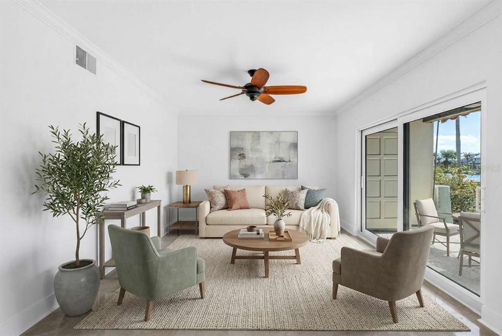 A living room features a beige sofa, two armchairs, a round coffee table, and sliding doors — 509 PLAZA SEVILLE COURT UNIT 19, TREASURE ISLAND, FL
