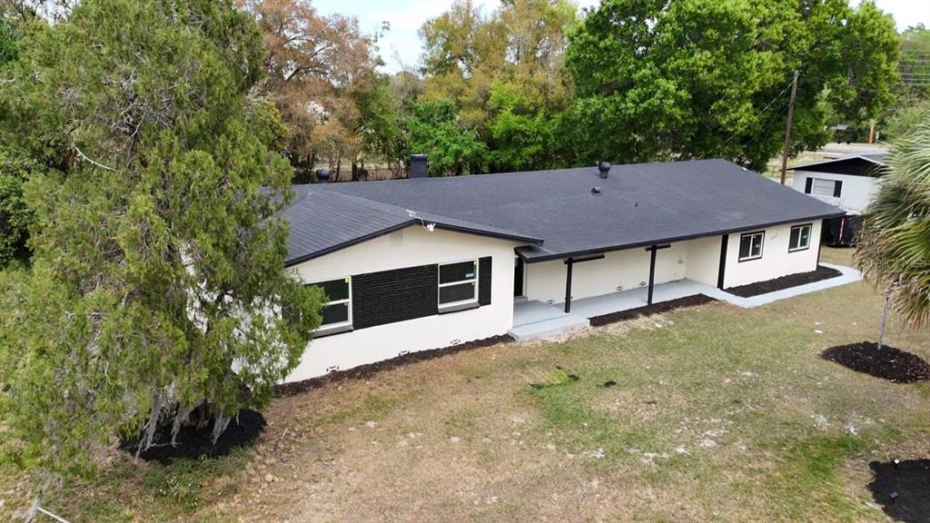 An aerial view of a single-story house with a black roof and white exterior walls — 4217 WD JUDGE DRIVE UNIT W, ORLANDO, FL