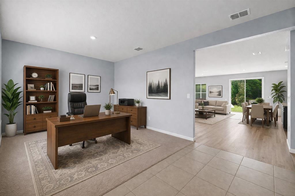 A home office with a wooden desk and bookshelf opens into a living and dining area — 1512 TAN TARA TRAIL, JACKSONVILLE, FL