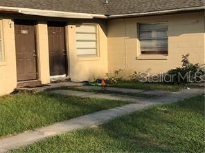 The exterior of a single-story building features two brown doors and a window — 4150 PEAR ROAD, MULBERRY, FL