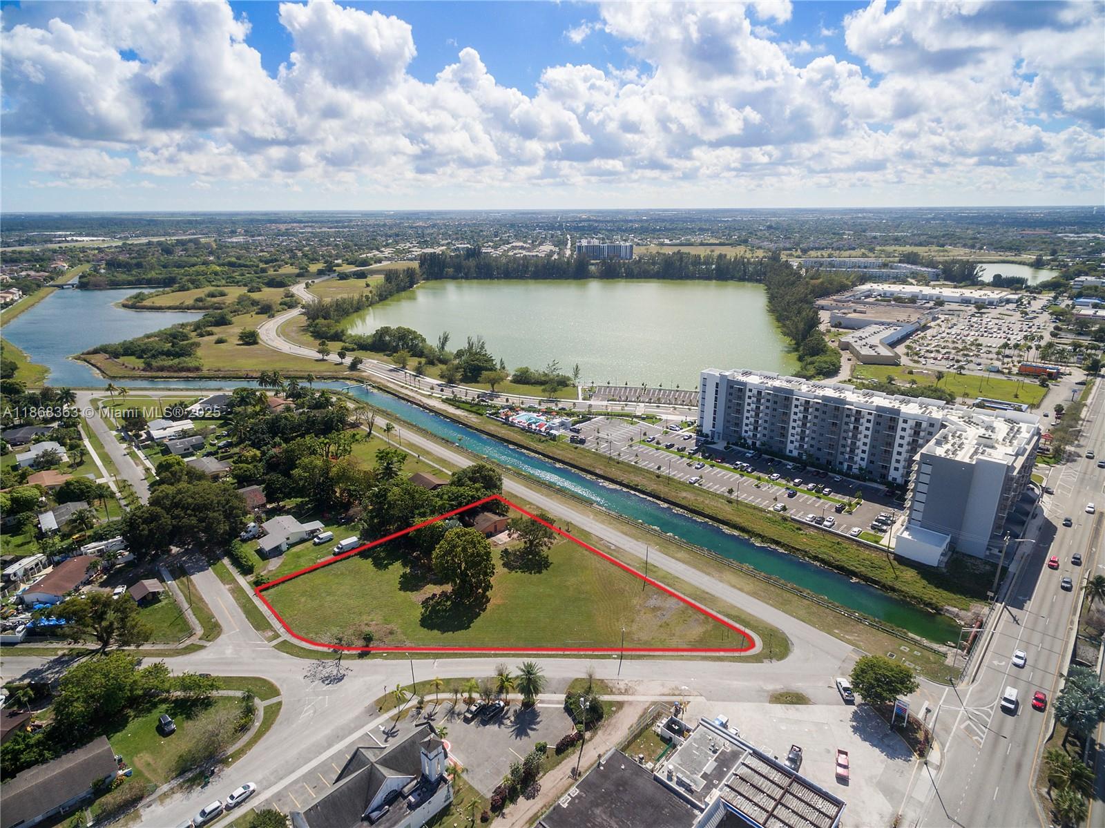 An aerial view shows a triangular vacant lot outlined in red next to a canal — 272 Street, Naranja FL 33032, NARANJA, FL
