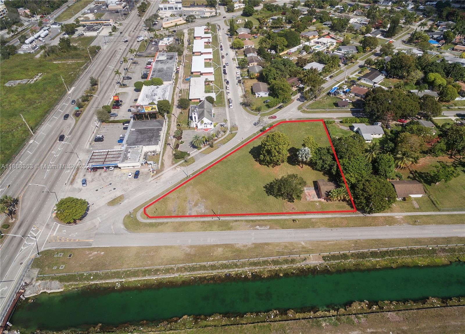 An aerial view shows a triangular plot of land outlined in red near a canal — 272 Street, Naranja FL 33032, NARANJA, FL