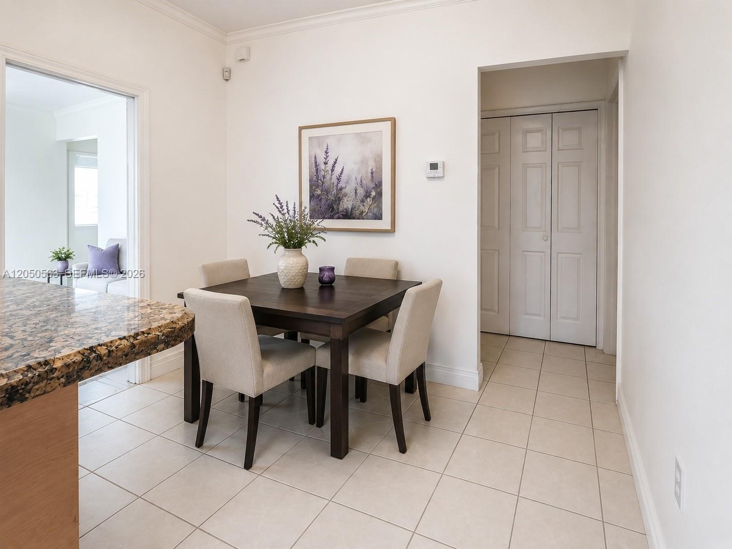 A dining area features a dark wood square table with four beige upholstered chairs — 14326 SW 177th Ter, Miami FL 33177, MIAMI, FL