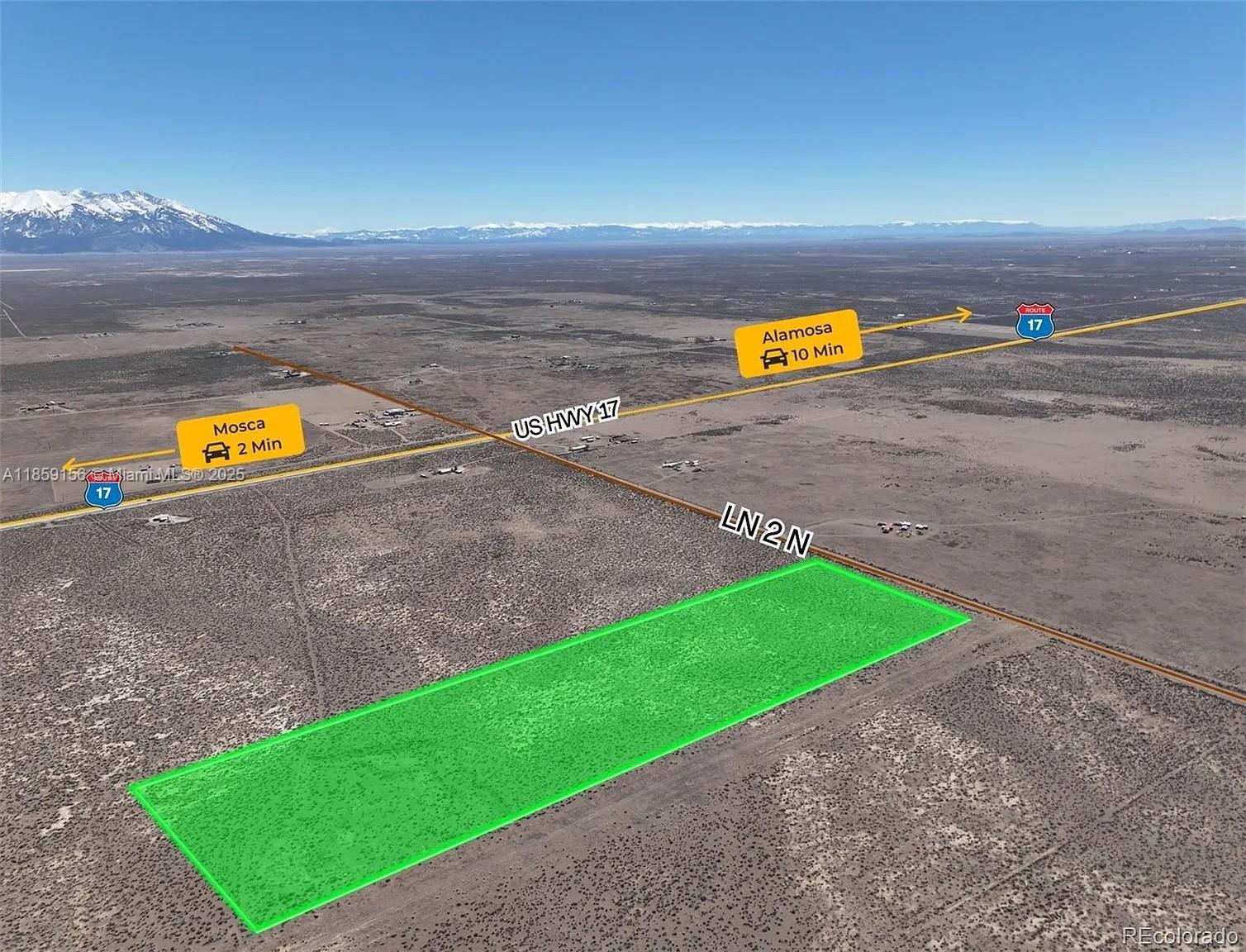 An aerial view shows a rectangular plot of land highlighted in green near a highway — 10 N 2 Lane, CO 81146, CO