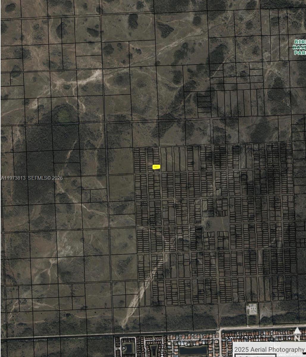 This is an aerial map showing a highlighted rectangular parcel of land among many others — 26st sw 167ave, Miami FL 33185, MIAMI, FL