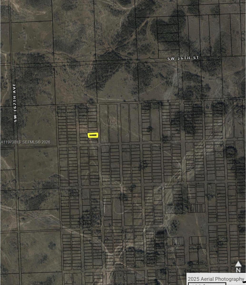 This is an aerial map showing a highlighted rectangular land parcel within a grid layout — 26st sw 167ave, Miami FL 33185, MIAMI, FL