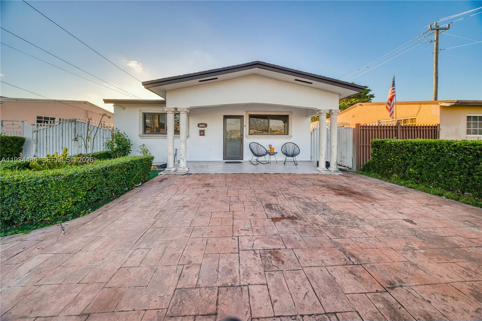 A single-story house features a paved driveway, a covered front porch with columns, and landscaping — 3640 SW 92nd Ave, Miami FL 33165, MIAMI, FL