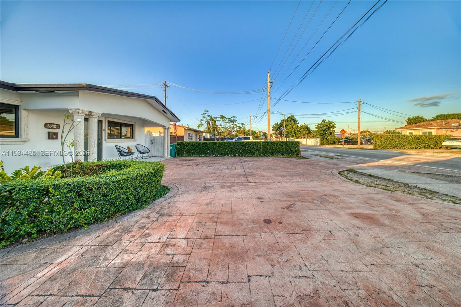 A paved driveway leads to the front entrance of a single-story house with landscaping — 3640 SW 92nd Ave, Miami FL 33165, MIAMI, FL