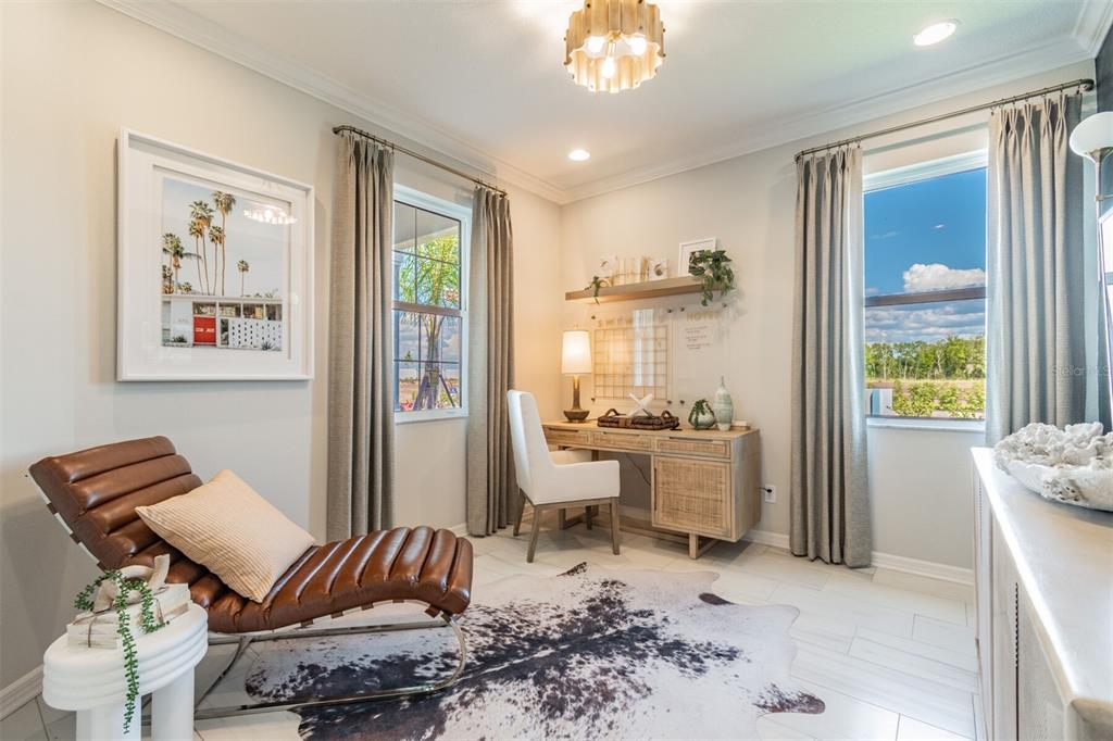 A home office features a leather chaise lounge, a wooden desk, and a cowhide rug — 1649 ROYAL COURT, PORT CHARLOTTE, FL