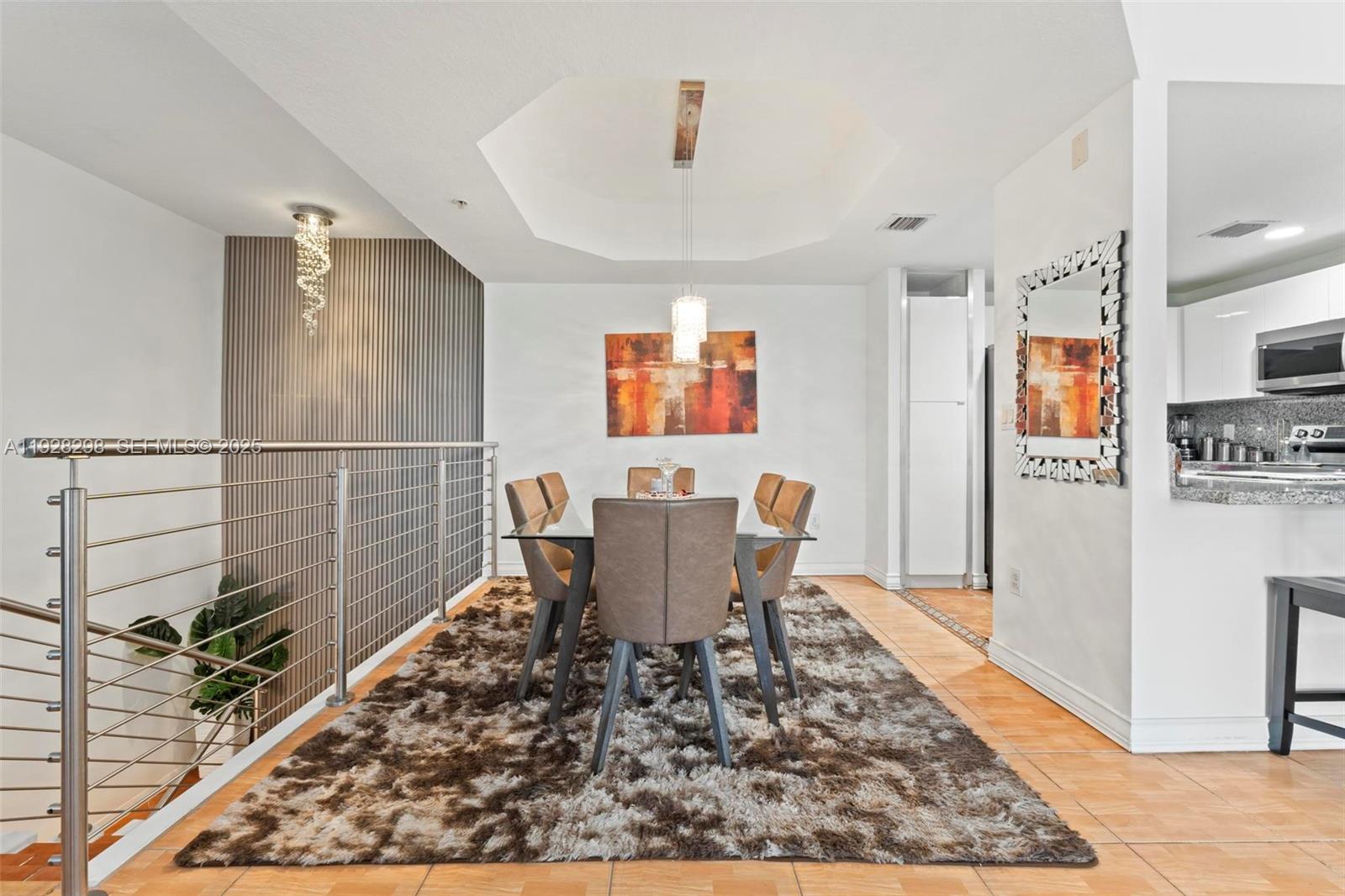 A dining room features a glass table, shaggy rug, and a modern chandelier — 6500 NW 114th Ave # 1032, Doral FL 33178, DORAL, FL