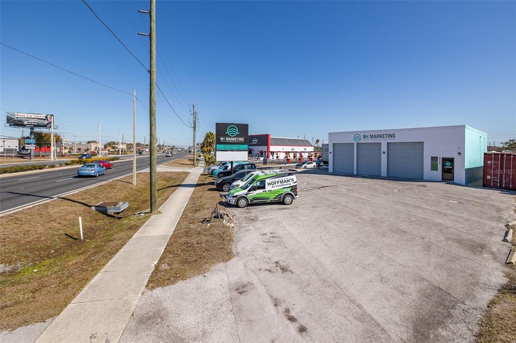 An exterior view of a commercial building with a parking lot and signage — 8312 US HIGHWAY 19, PORT RICHEY, FL