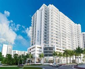 A digital rendering of a tall, modern white residential high-rise building with balconies and palm trees — 301 QUAY COMMONS UNIT 904, SARASOTA, FL