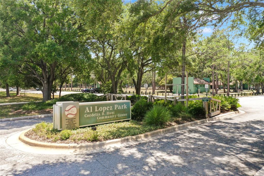 A sign for Al Lopez Park and the Cordelia B. Hunt Community Center stands outdoors — 7012 N WILLOW AVENUE, TAMPA, FL