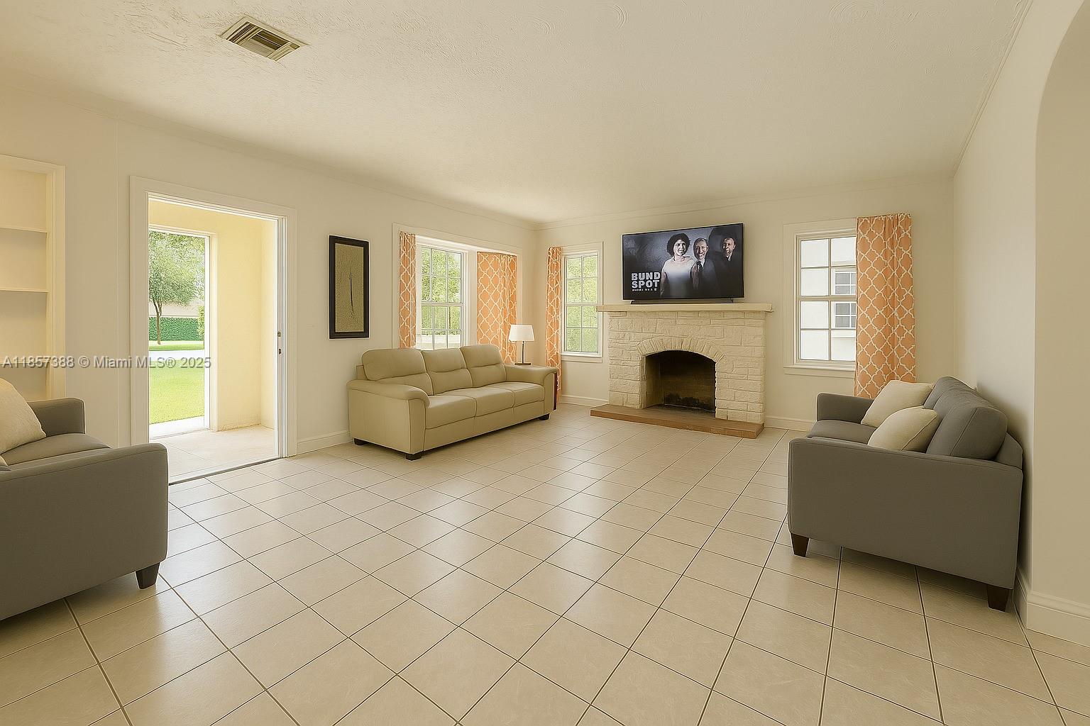 A living room features tile floors, a brick fireplace with a television, and three sofas — 2619 SW 5th St, Miami FL 33135, MIAMI, FL