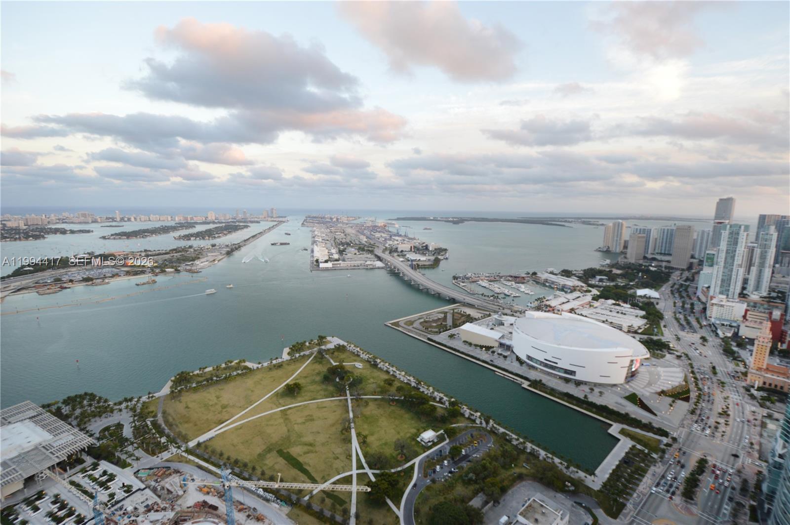An aerial view shows a park, a large arena, a bridge, and the Miami waterfront — 1100 Biscayne Blvd # 6104, Miami FL 33132, MIAMI, FL