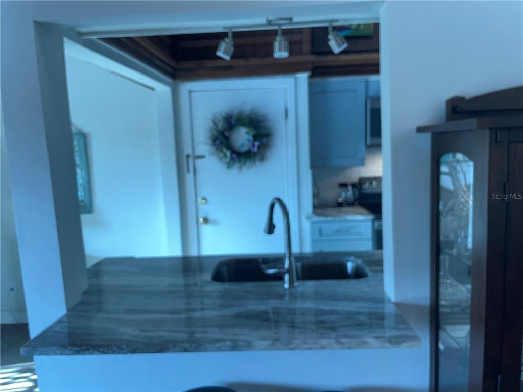 A view of a lake and a boat dock seen through a screened window — 200 MAITLAND AVENUE UNIT 182, ALTAMONTE SPRINGS, FL