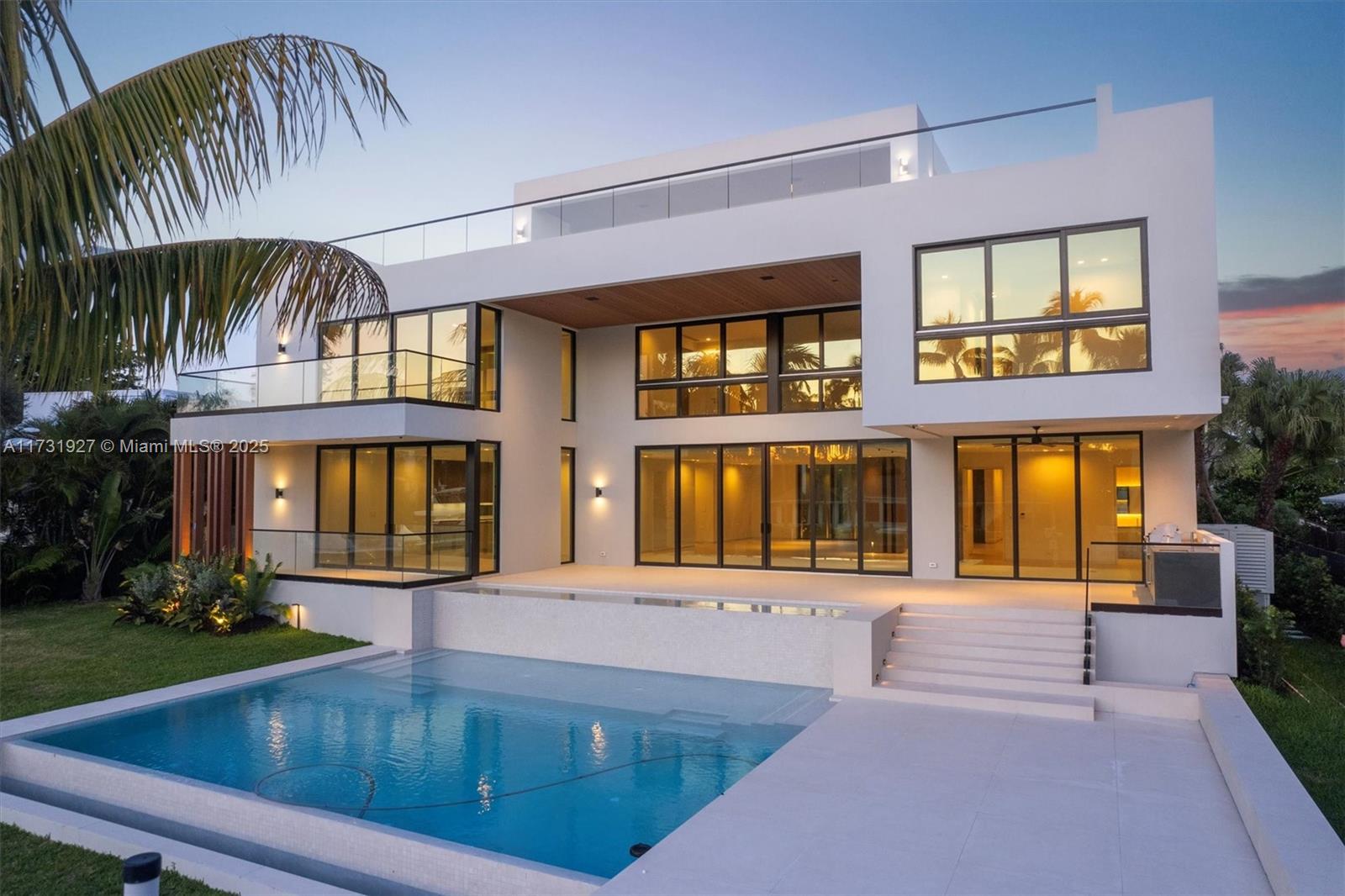 A modern multi-story white house features a swimming pool, glass balconies, and large floor-to-ceiling windows — 960 Mariner Dr, Key Biscayne FL 33149, KEY BISCAYNE, FL